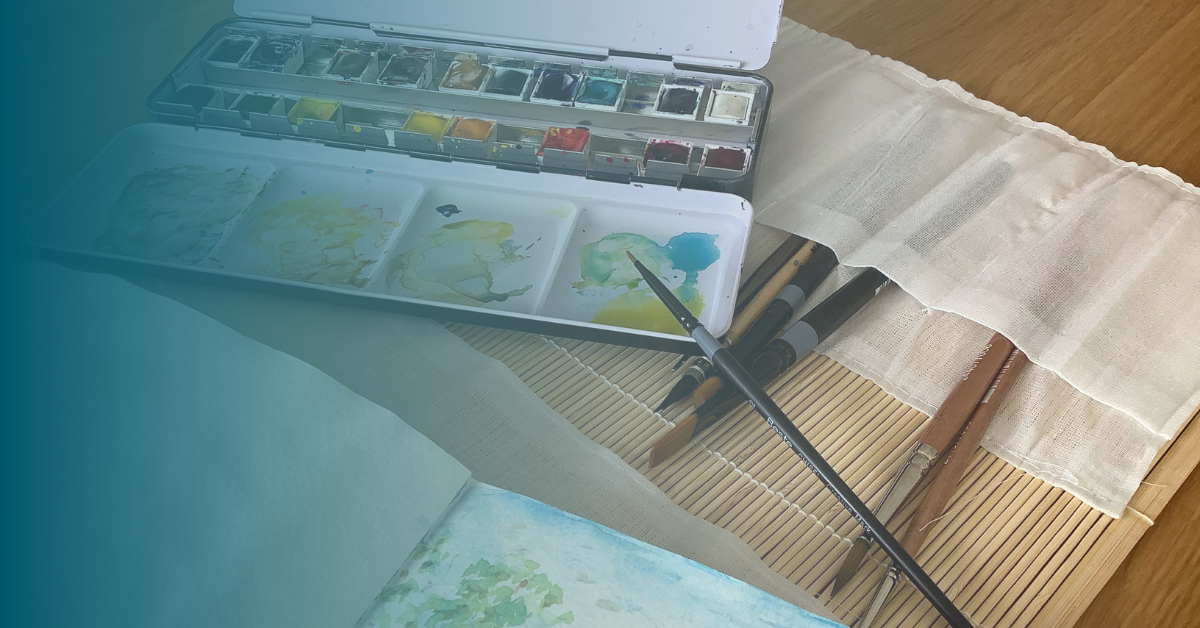 Photo of a paint palette and pain brushes
